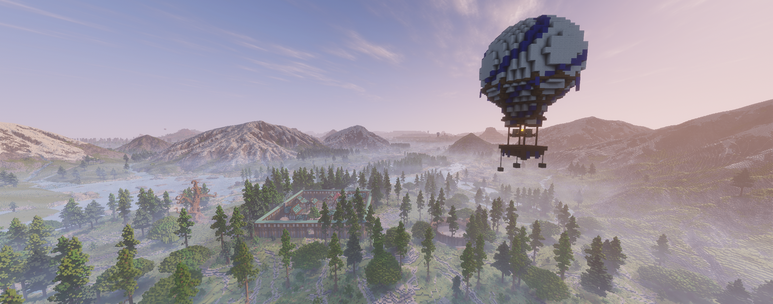 WolfClan landscape with snowy mountains and a blue hot air balloon